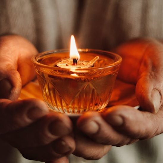A Person Holding a Candle