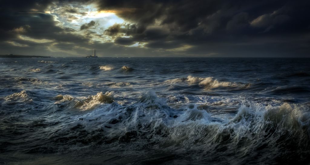 Capture the powerful waves and dark stormy skies over Whitley Bay's ocean seascape.