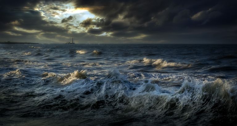Capture the powerful waves and dark stormy skies over Whitley Bay's ocean seascape.